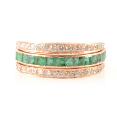 Lot 268 - An emerald, sapphire and diamond full eternity ring, "night and day" style.