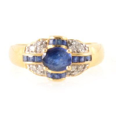 Lot 264 - A sapphire and diamond multi stone dress ring.