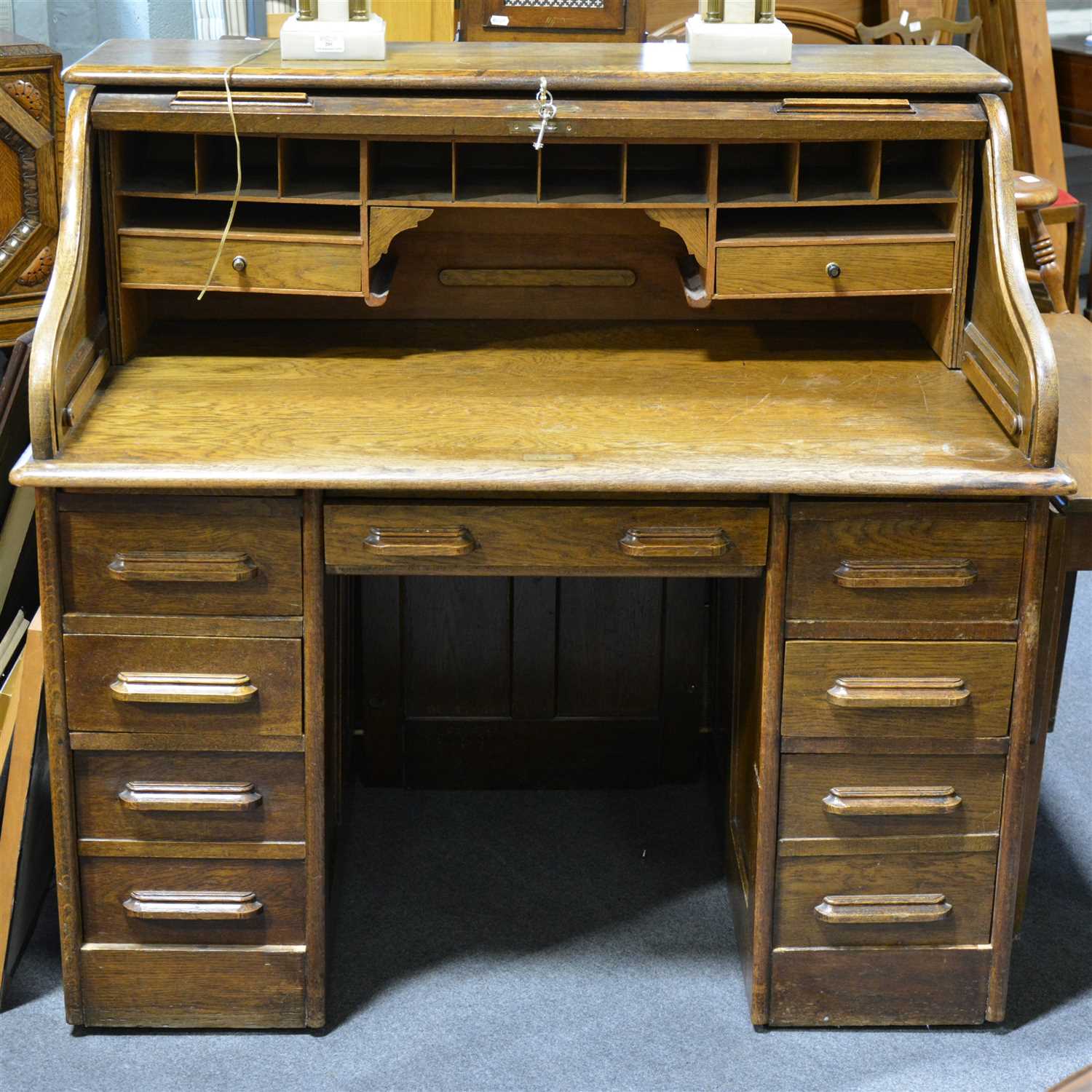 Lot 560 - An oak roll top desk, ...