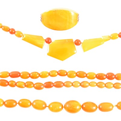 Lot 343 - Three amber coloured bead necklaces and a brooch