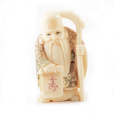 Lot 169 - Japanese netsuke of an elder holding a scroll, stained detailing