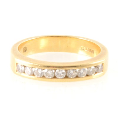 Lot 250 - A diamond half eternity ring.