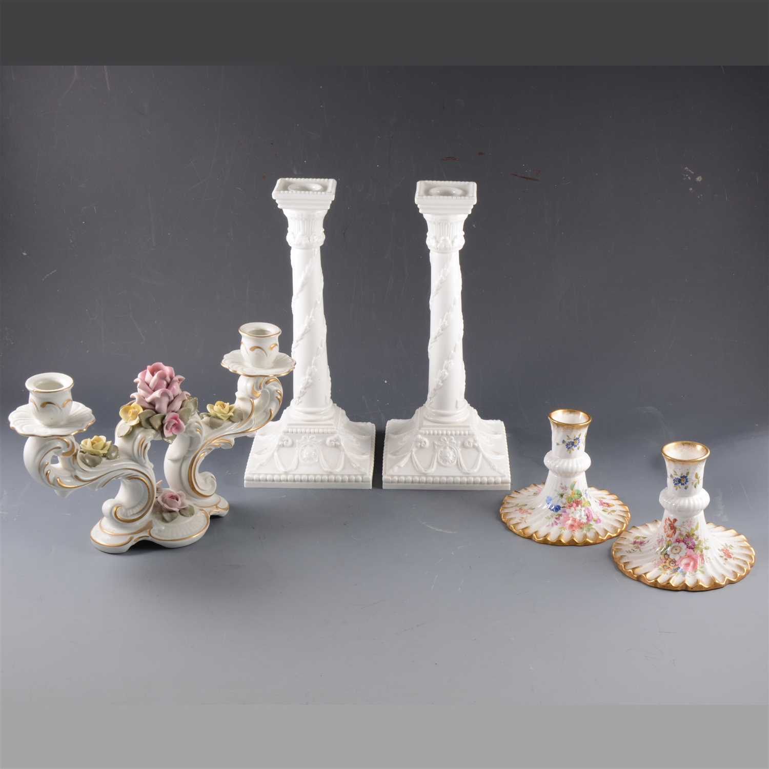 Lot 36 - A pair of Royal Worcester plain white candlesticks, ...