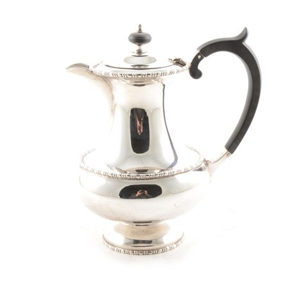 Lot 424 - A silver coffee pot in the Queen Anne style with egg bead borders.