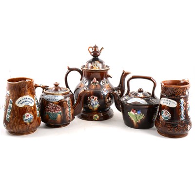 Lot 33 - A collection of Measham pottery, including teapot and stand, small teapot, kettle and two milk jugs.