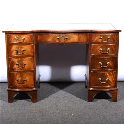 Lot 670 - A reproduction mahogany finish triple bowfront desk