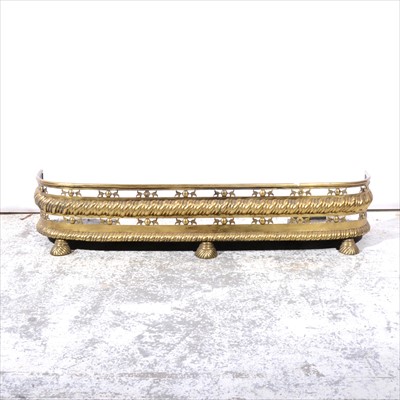 Lot 404 - An Edwardian style brass rail fender, and two other brass fenders