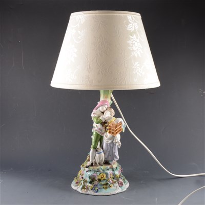 Lot 113 - A Continental porcelain lamp base, modelled as a young couple, ...