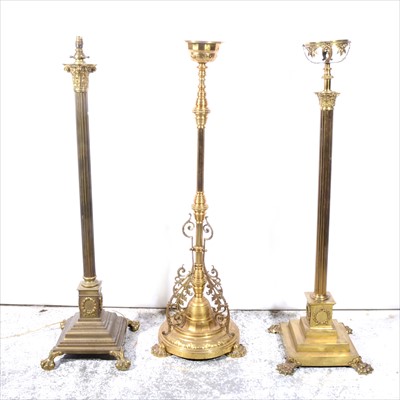 Lot 400 - A modern brass Corinthian column standard lamp, and two brass oil lamp bases