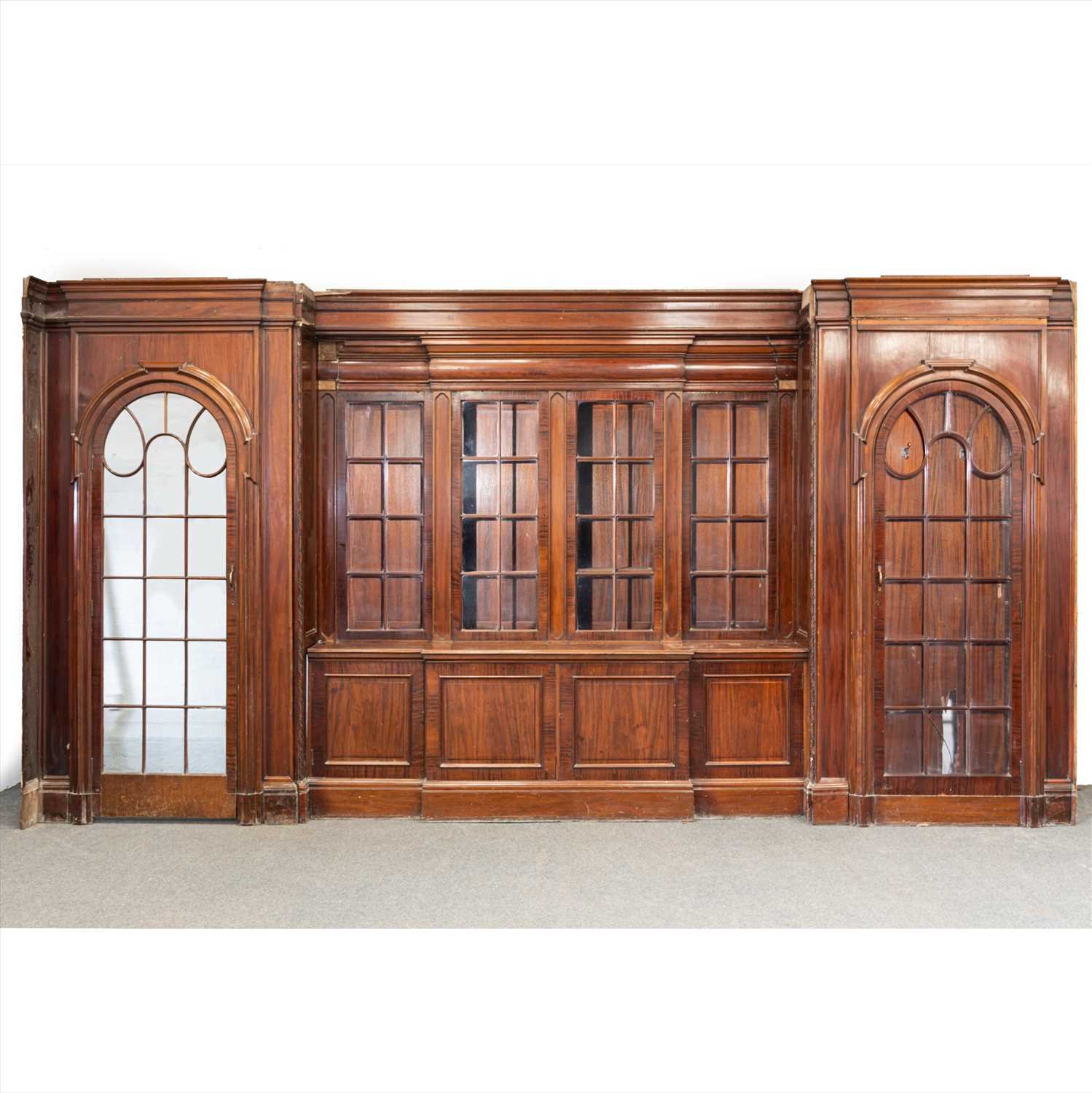 Lot 515 - A large mahogany bookcase fascia, designed by Sir Edwin Lutyens for the Billiard Room of Papillon Hall
