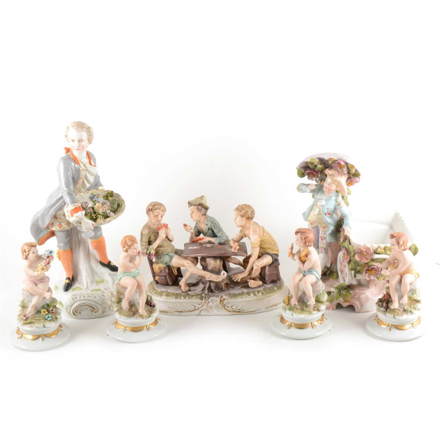 Lot 7 - A Continental porcelain group, boys playing cards, ...