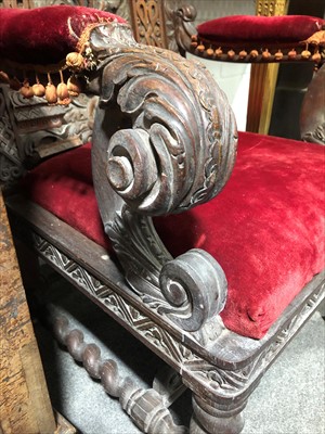 Lot 520 - Carved oak baronial-style chair