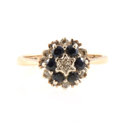 Lot 203 - A sapphire and diamond circular cluster ring