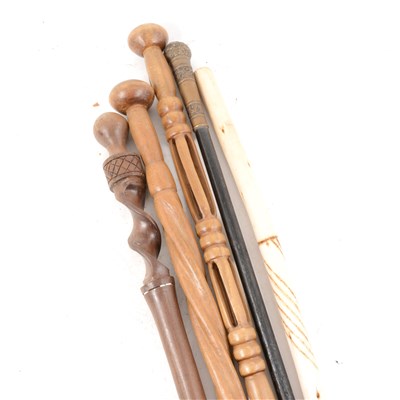 Lot 316 - Three Ethnic hardwood walking-sticks, ...