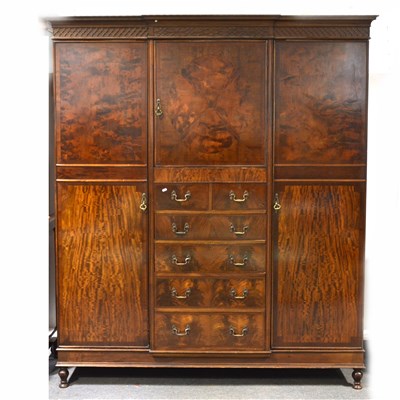 Lot 344 - A mahogany part-fitted breakfront wardrobe, ...