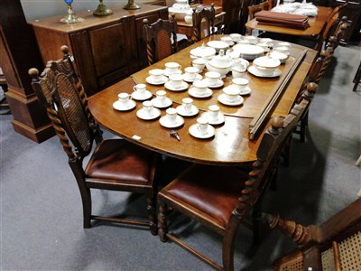 Lot 534 - An oak dining room suite, comprising an oak drawleaf table, ...
