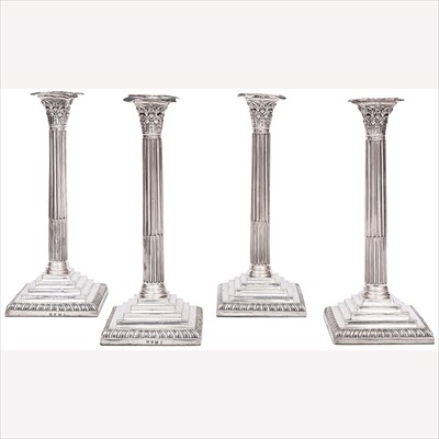 Lot 616 - A set of four George III silver Corinthian column table candlesticks