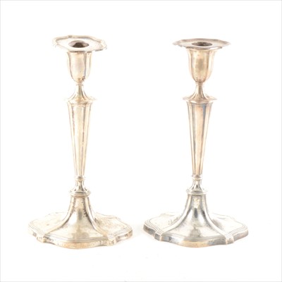 Lot 266 - A pair of Edwardian silver table candlesticks, Hawksworth Eyre & Co., ...