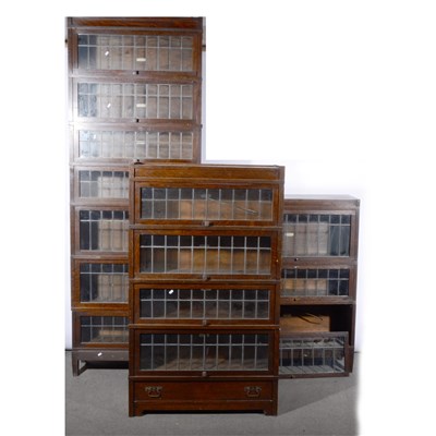 Lot 537 - An assemblage of oak sectional bookcases, labelled Globe-Wernicke Co. Limited, ...