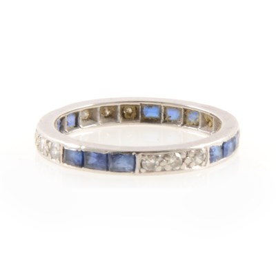 Lot 266 - A sapphire and diamond full eternity ring