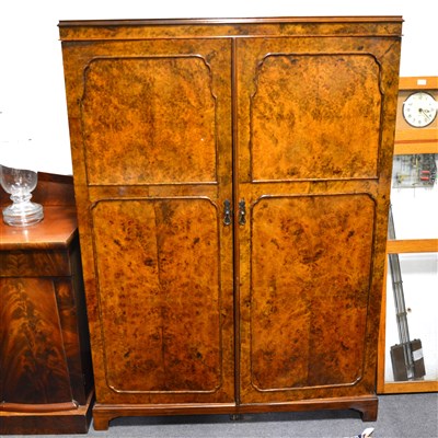 Lot 455 - A figured walnut compactum wardrobe, ...