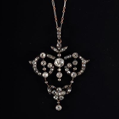 Lot 685 - An Edwardian diamond pendant and chain.