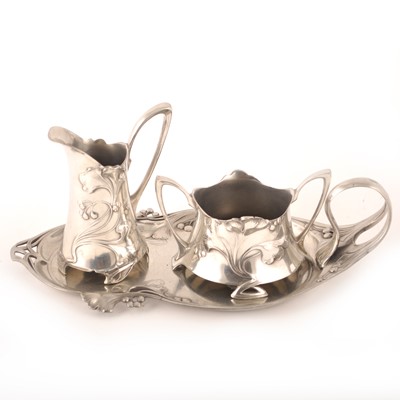 Lot 605 - An Art Nouveau silvered metal sugar and cream stand, by WMF.