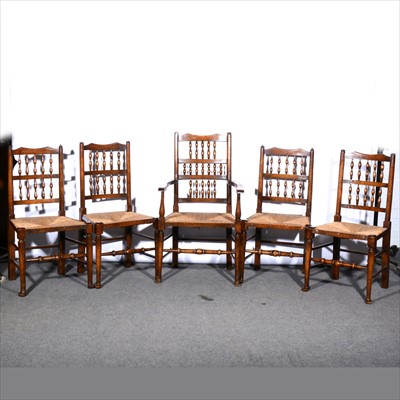 Lot 576 - A set of five Lancashire type oak spindle back chairs