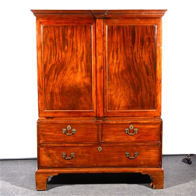 Lot 382 - A George III mahogany linen press, of small proportions, ...