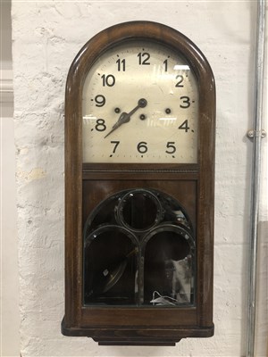 Lot 552 - A stained wood wall clock, early 20th century.