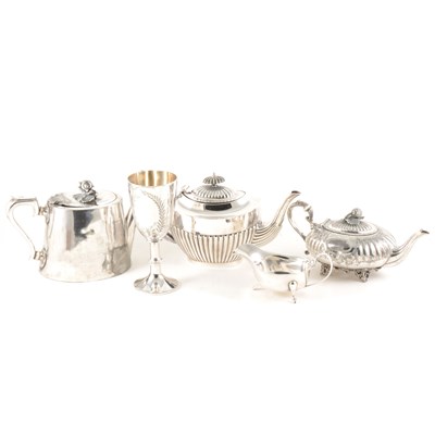 Lot 126 - A quantity of silver plated wares, including teapots, salver, gravy boat and dish, goblet etc.