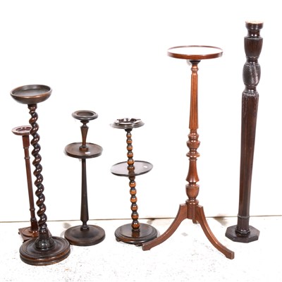 Lot 425 - A mahogany torchere, stands, and smoker's companions