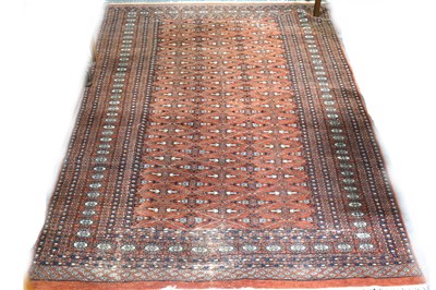 Lot 488 - A Bokhara rug, trellis design on a red field, ...