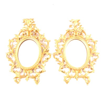 Lot 239 - A pair of Florentine style carved gilt wood mirrors of small size, ...