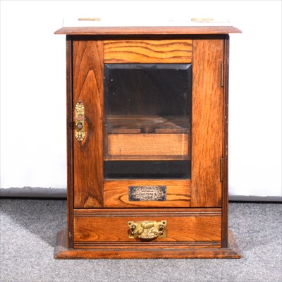 Lot 519 - An oak smoker's cabinet, ....