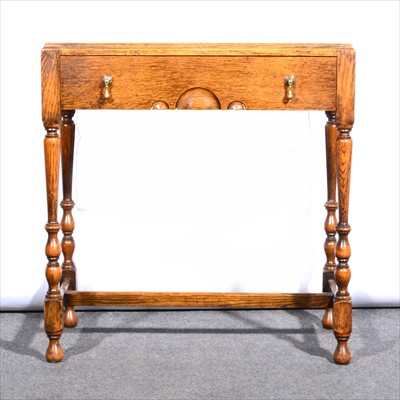 Lot 557 - An oak hall table, ...