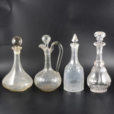 Lot 94 - A cut glass claret jug, 31cm; a collection of decanters.