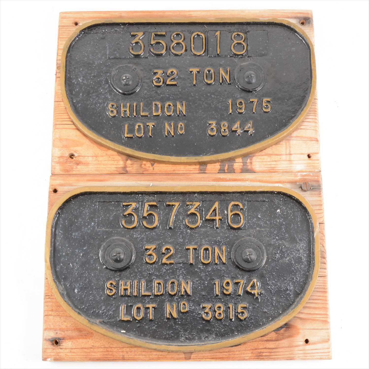 Lot 39 - Two cast iron railway plaques; 358018 32 ton Shildon 1975 lot no 3844, 28cm by 17cm, and a 357346 32 Ton Shildon 1974 lot no 3815, 28cm by 17cm, both mounted on wood.