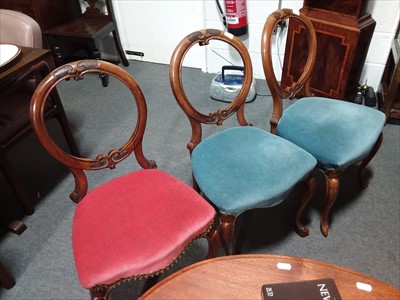 Lot 549 - Three Victorian walnut balloon-back dining...