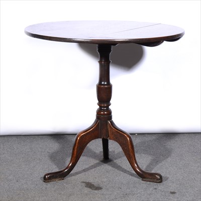 Lot 435 - An old oak pedestal table, circular tilt top,...