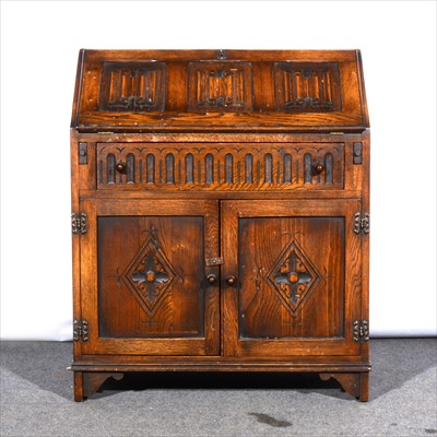 Lot 507 - A reproduction oak bureau, fall front with...