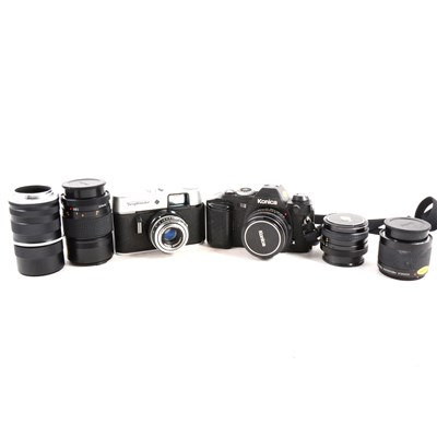 Lot 118 - Konica FS-1 SLR camera, with associated lenses, and another camera