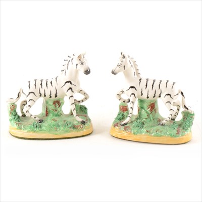 Lot 49 - A pair of Staffordshire pottery 'Zebra' models