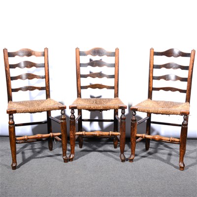 Lot 533 - A set of six elm and ash ladder-back dining chairs