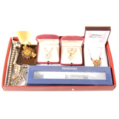 Lot 200 - A Swarovski pen, two pendants, earrings, simulated pearl necklace, bracelet and a pair of earrings, amber necklace and paste brooch.