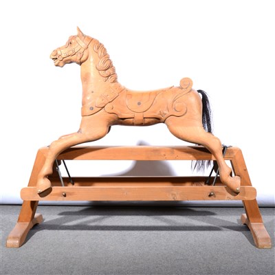 Lot 544 - A carved pine rocking horse, ...