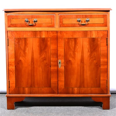 Lot 646 - A reproduction yew wood finish side cabinet