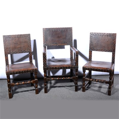 Lot 623 - A set of six Restoration style joined oak and leather covered dining chairs, ...