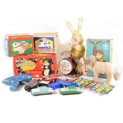 Lot 123 - Tin-plate, battery operated and wind-up toys; including Atomic space gun, Winky the Pup and others, some boxed.