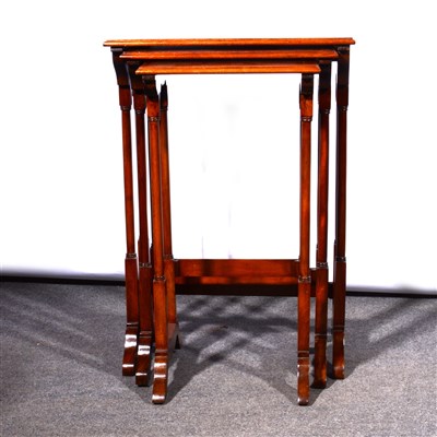 Lot 696 - Nest of three mahogany occasional tables, with...